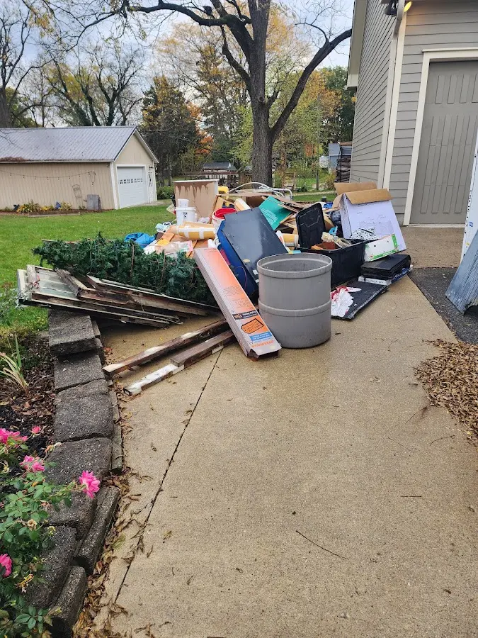 Dumpster being loaded with debris for Estate Cleanout Dumpster Rental in Palermo